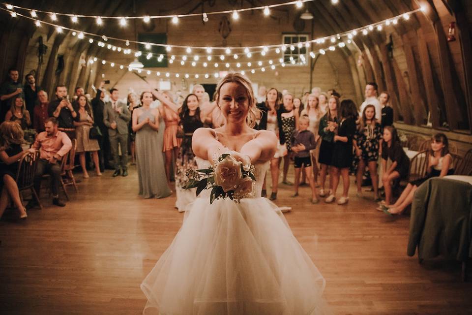 The History Behind the Bouquet & Garter Toss - Arkansas Bride