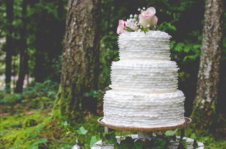 Bride Holding A Tiered Wedding Cake On Vintage Silver Tray Stock Photo -  Download Image Now - iStock