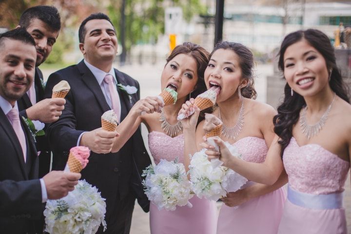 Wedding party eating ice cream cones