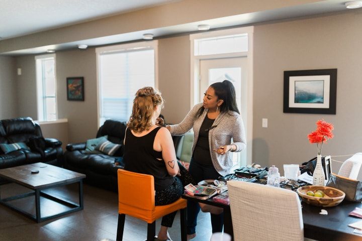 Wedding makeup artist applying makeup