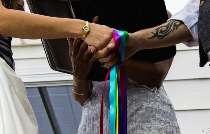 Handfasting ceremony with colourful ribbons