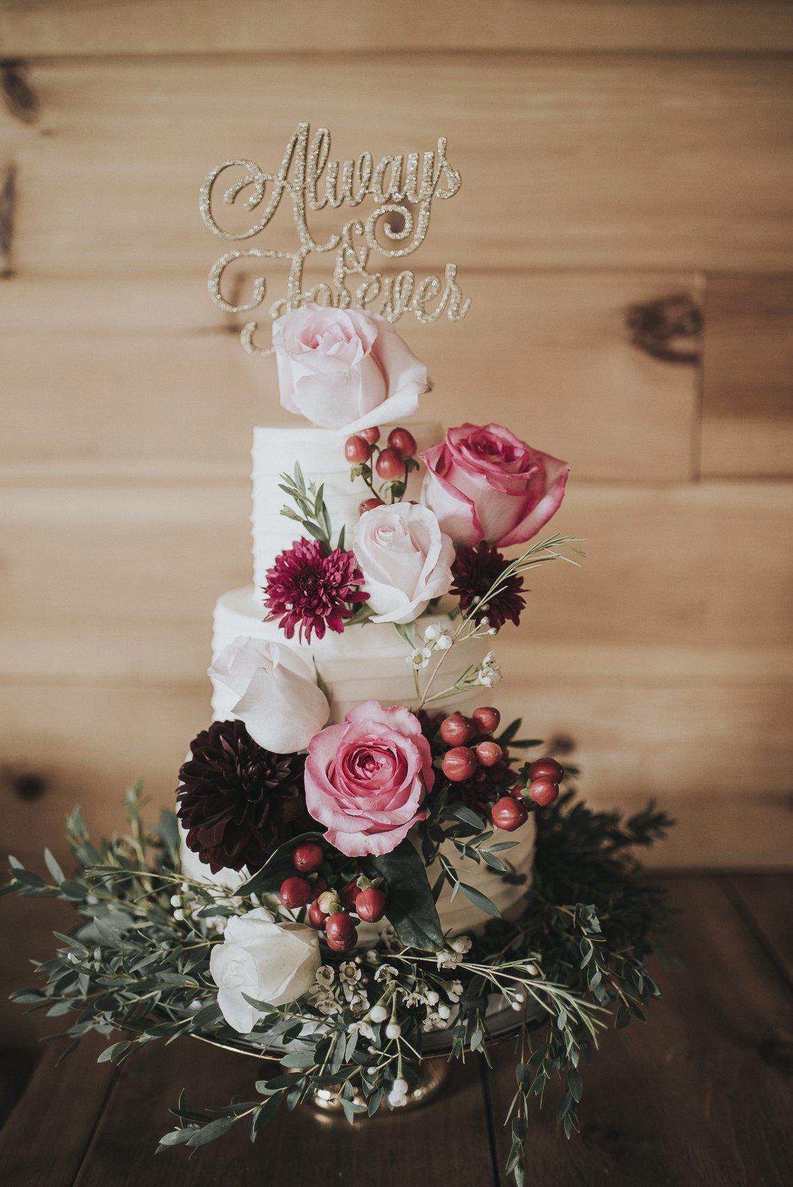 Rustic wedding cake with fresh flowers