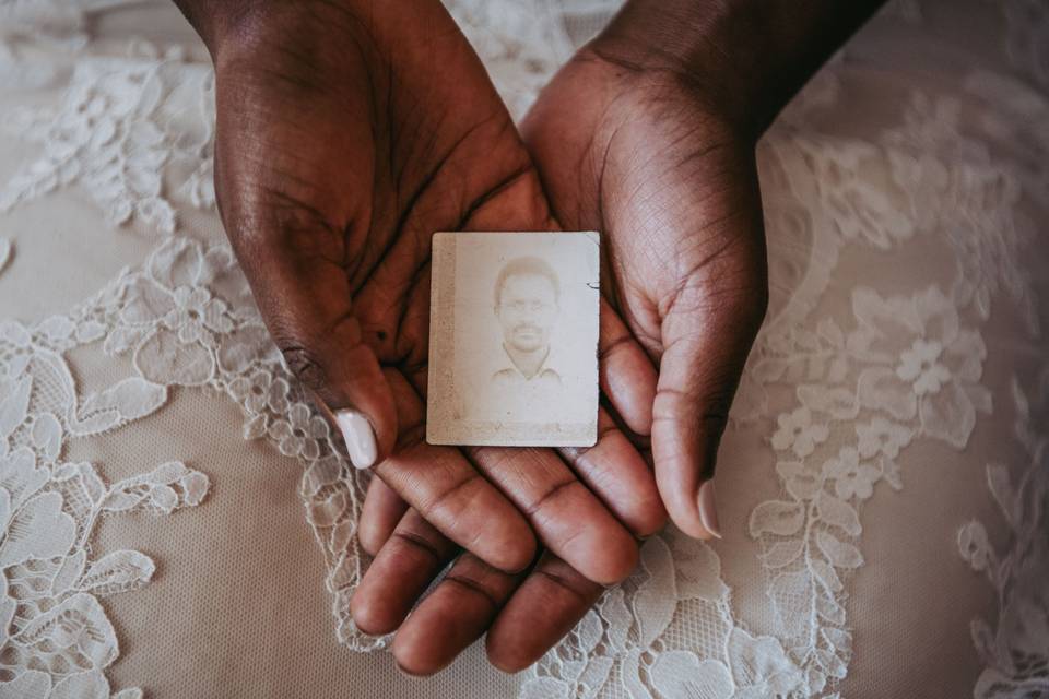 Bride holding loved one's photo