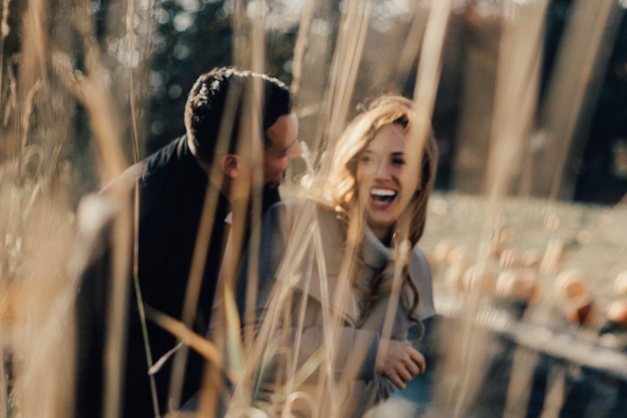 Fall engagement photo idea - grasses and pumpkin patch