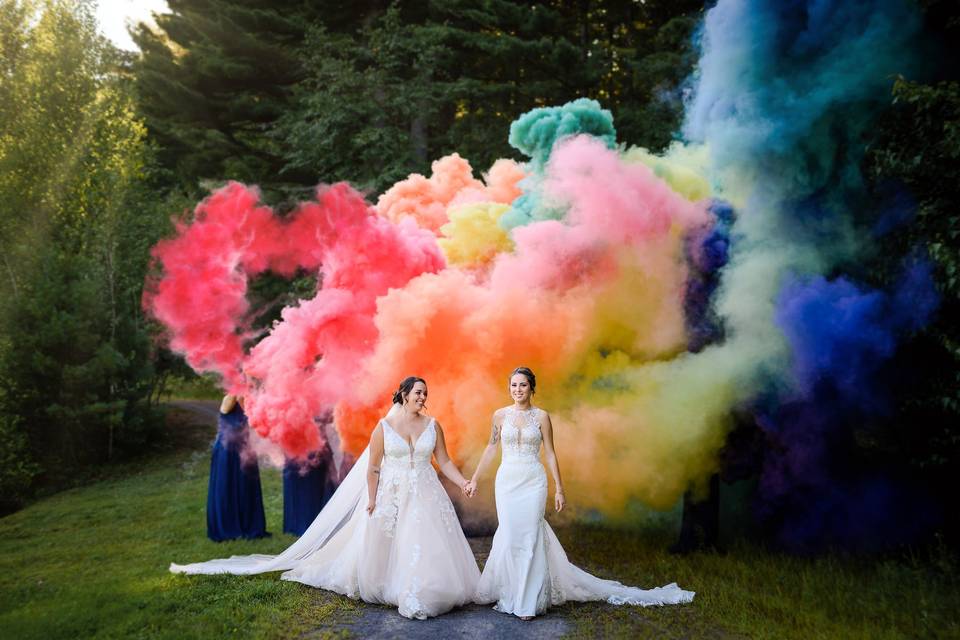 Rainbow smoke wedding portrait of two brides