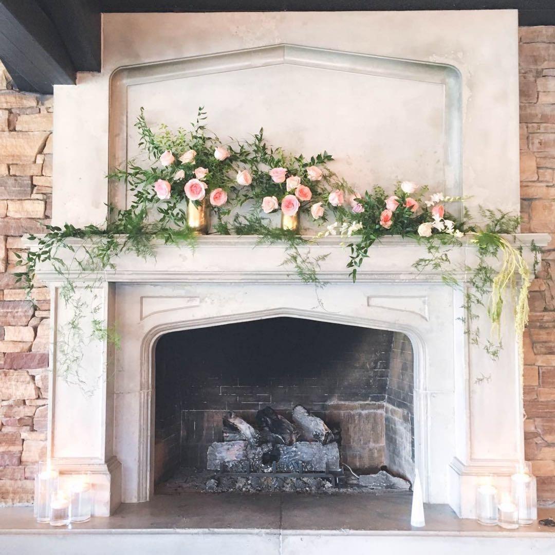Fireplace wedding decor - high-to-low flower arrangement