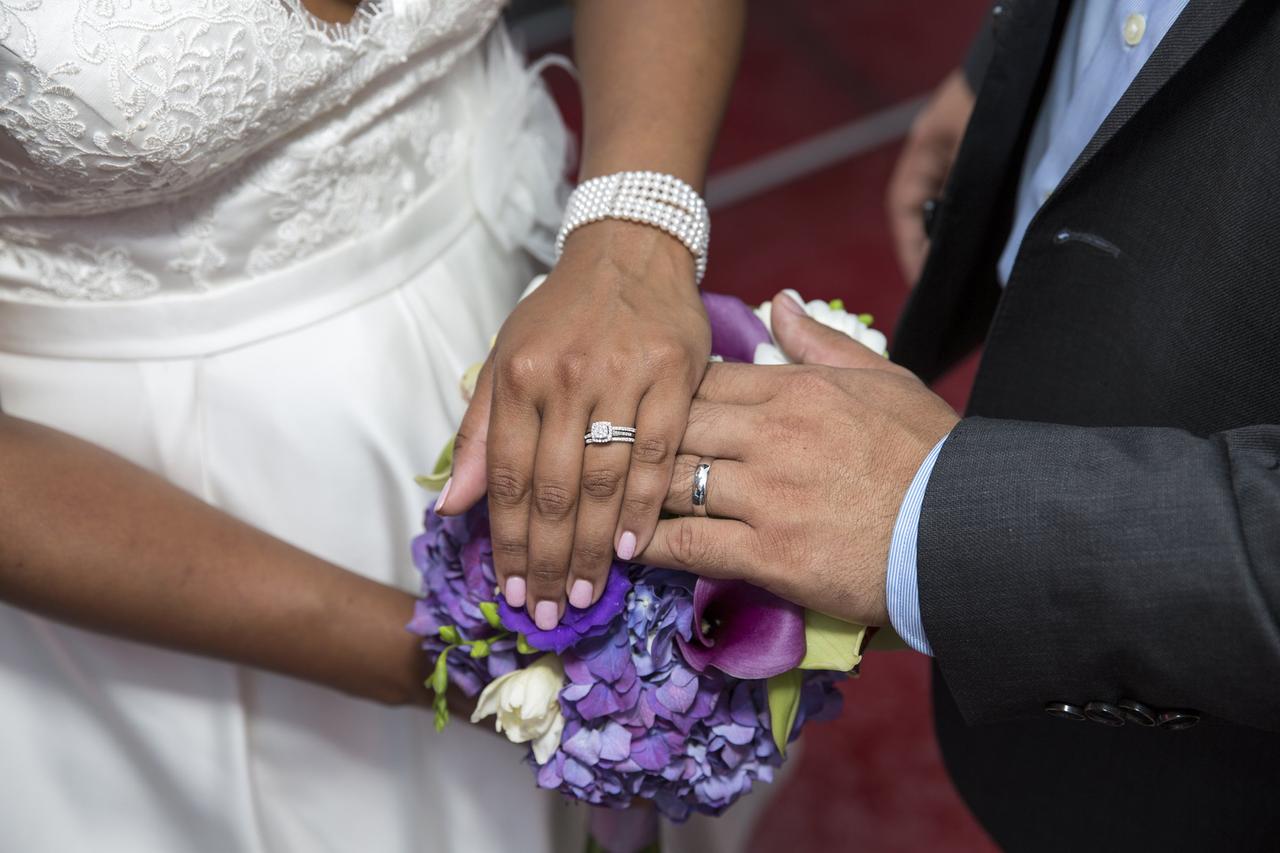 Wedding day manicure with bouquet