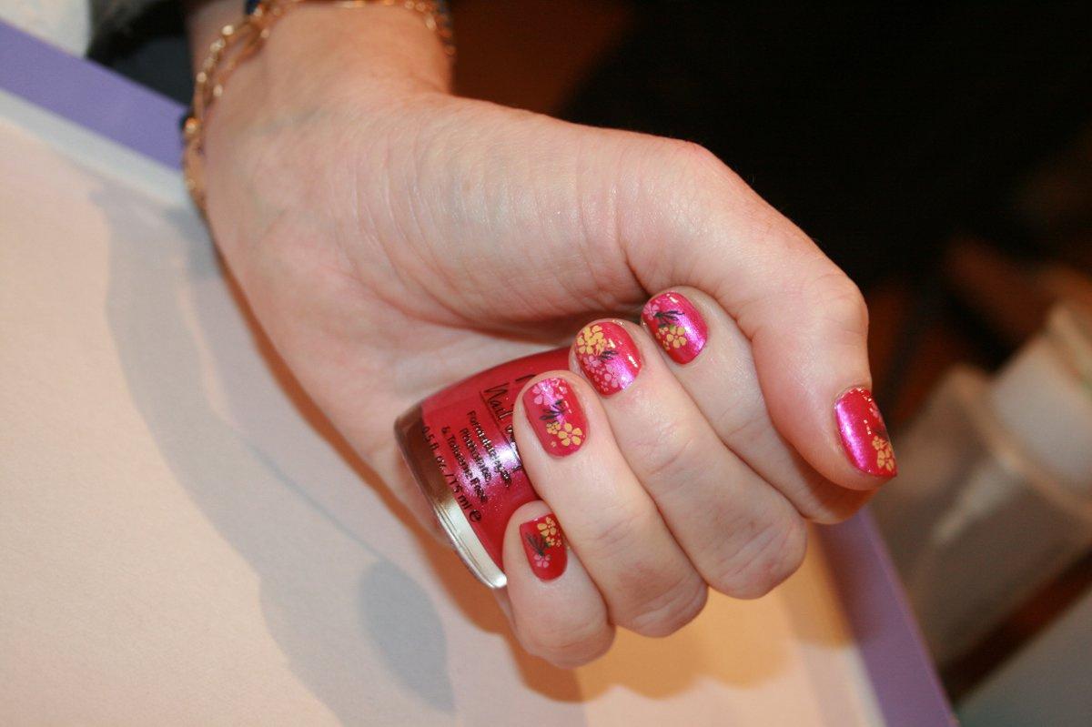 Red nail polish with design