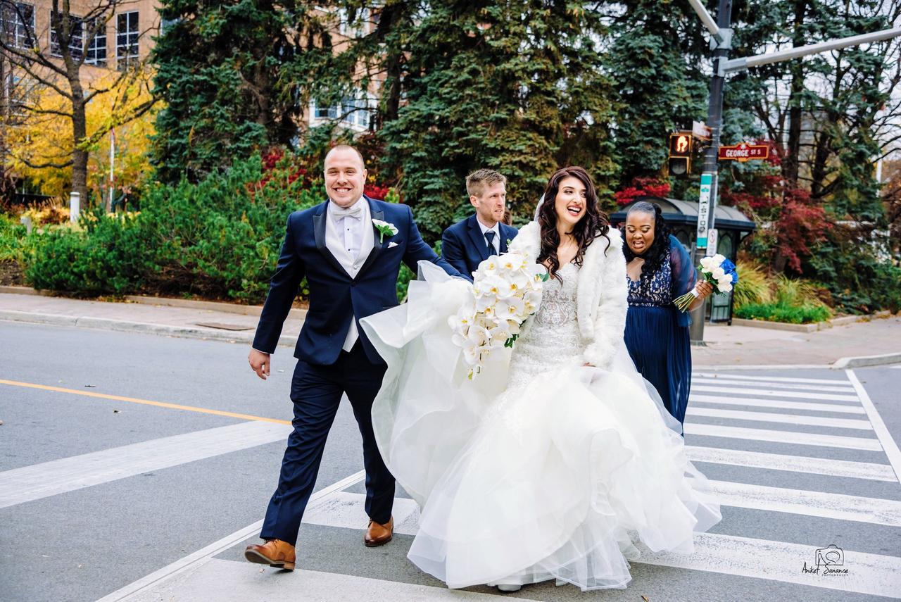 Bride and groom crossing the street