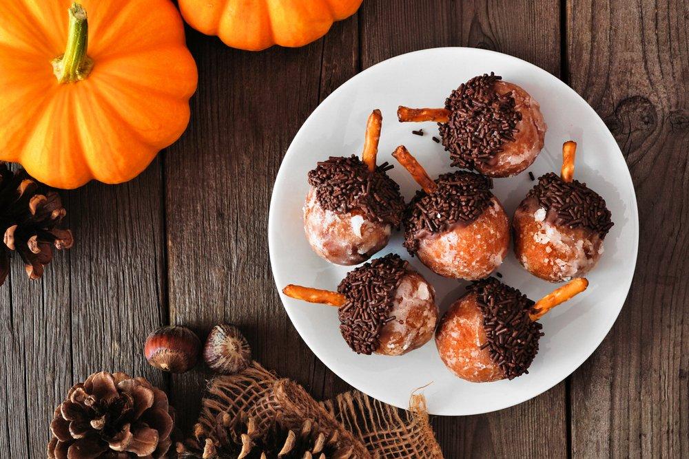 Pumpkin spice donut holes decorated to look like acorns