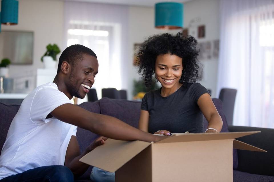 Couple opening a wedding registry gift