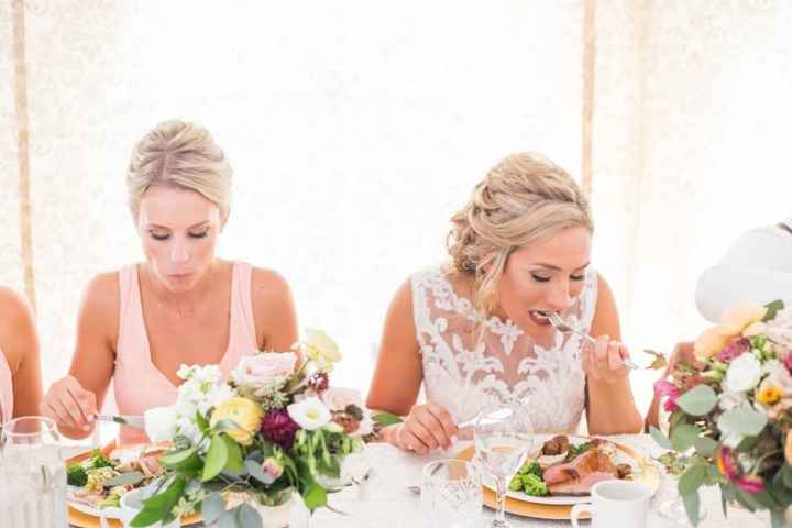 Bride eating at reception from King Cole Catering