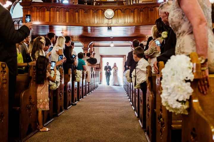 Father Escorting Bride Down The Aisle
