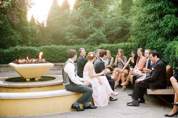 Guests chatting and mingling during gap between ceremony and reception