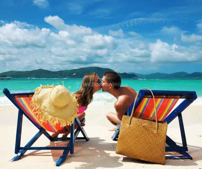 Newlyweds Kissing On Beach - Honeymoon