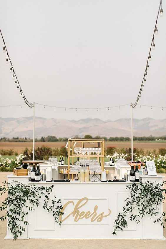 White Outdoor Bar with Cheers Sign