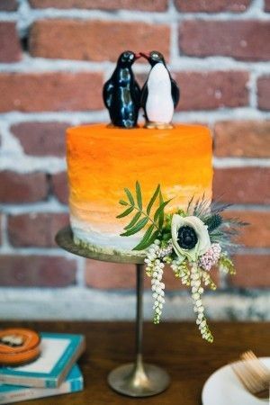 Penguin Figurine Cake Topper on Orange Cake