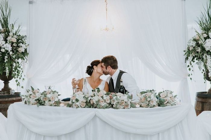 Reception Kiss at White Sweetheart Table