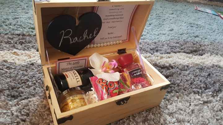 I made bridesmaid proposal boxes which included a little bottle of champagne, body wash, a candle, a