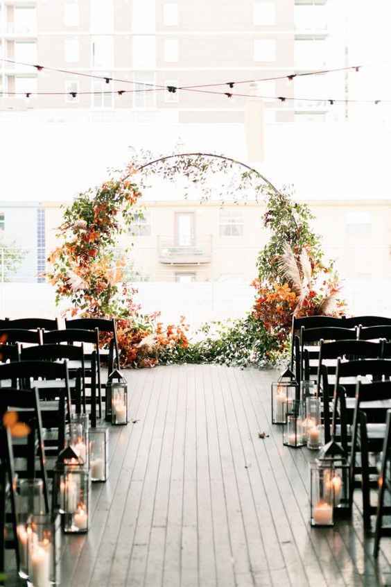 fall ceremony wedding lantern lights autumnal arch 