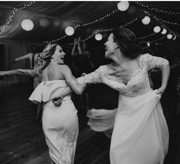 bride and maid of honour dancing