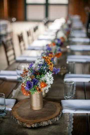 Rustic aluminium cans with mixture of fall flowers