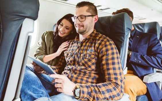 couple sitting on a plane together
