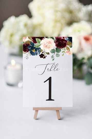 Table number one on easel, flower accents