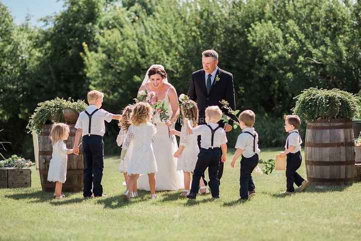 big group of flower girls and page boys
