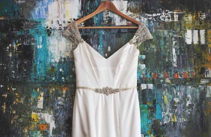 wedding dress with embellished cup sleeves on a colorful background