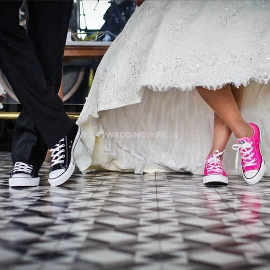 couple on wedding day wearing sneakers, black and pink