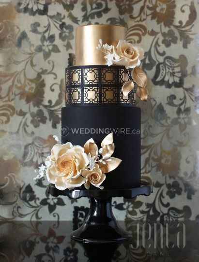 black and gold wedding cake with rose detail
