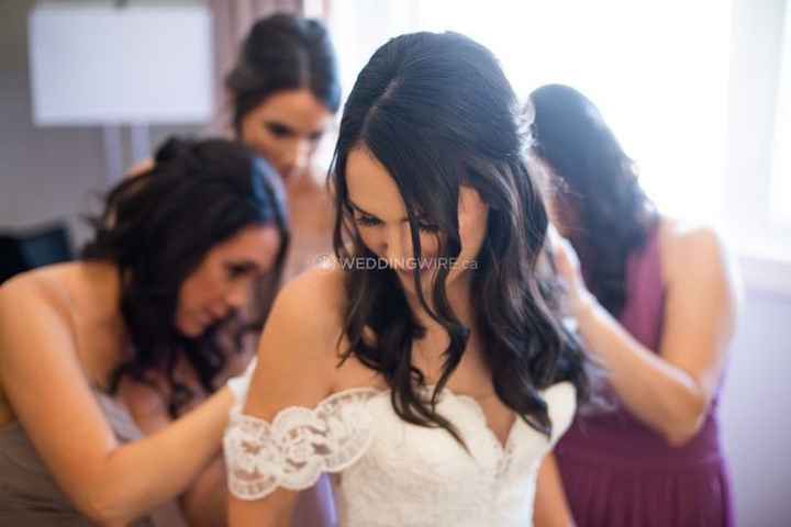 bride getting ready with bridemaids