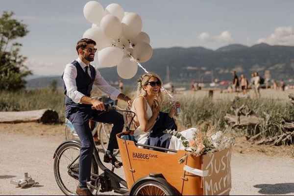 couple making their exit on a bicycle