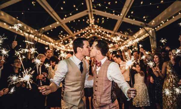 couple with sparklers, fairy lights decor