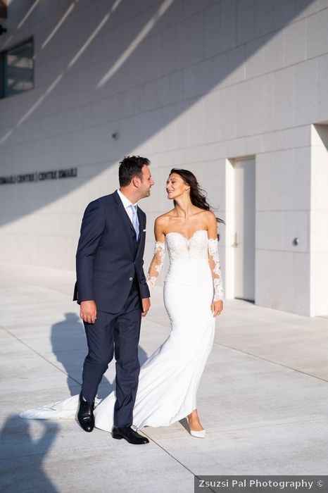 fitted wedding dress with off the shoulder and long sleeves