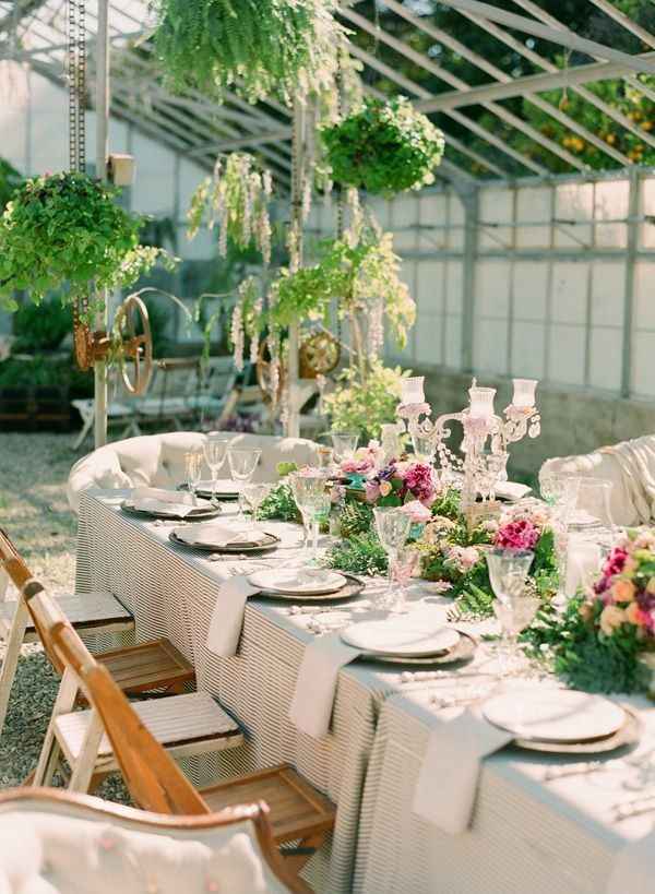oval shaped wedding table with flower centrepieces