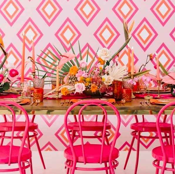 multicoloured wedding decor, pink, orange, green, fushia pink chairs