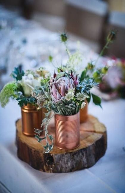 copper cans with flowers, rustic wedding centrepiece