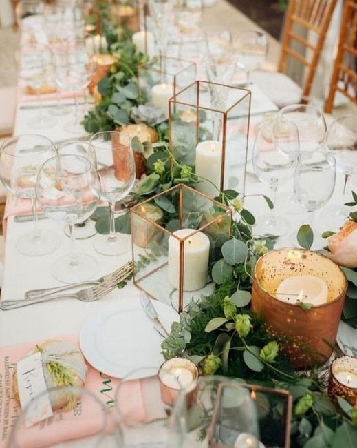 copper wedding centrepiece with candles and greenery