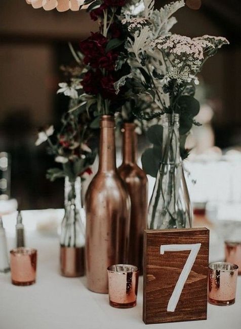 copper wine bottle with flowers, copper candles, wedding centrepiece