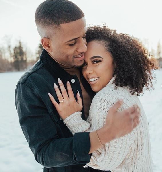 engaged couple, snowy backdrop