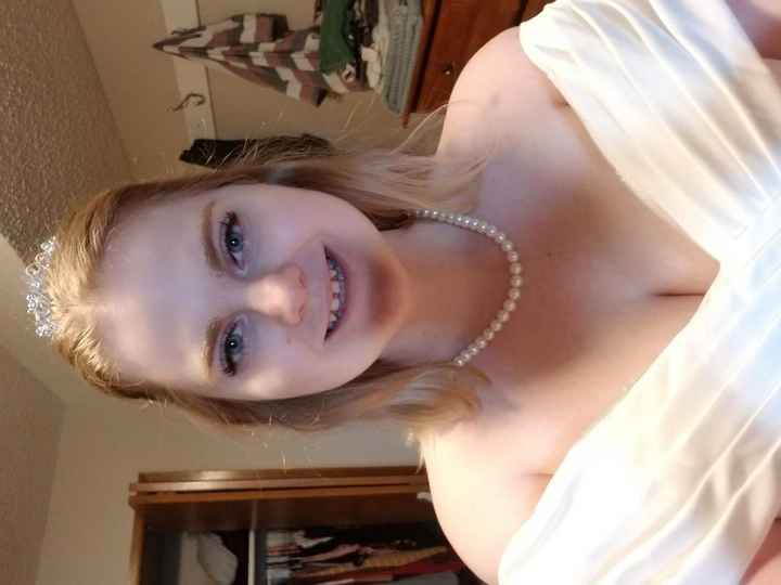 Trying on the wedding dress