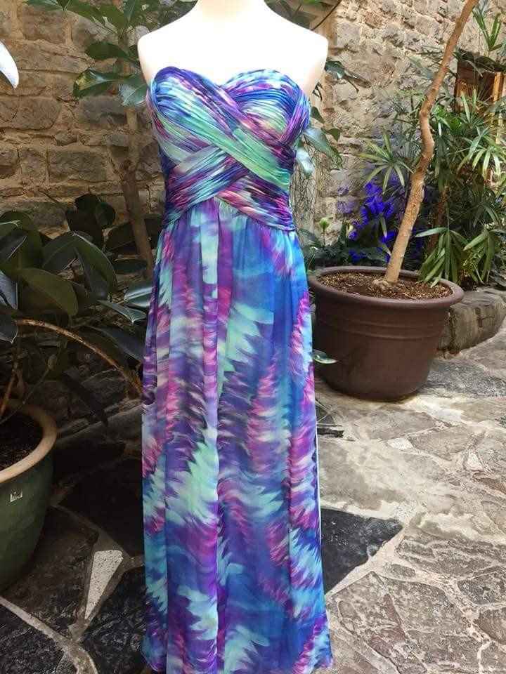 i need to find out who makes this dress - 1