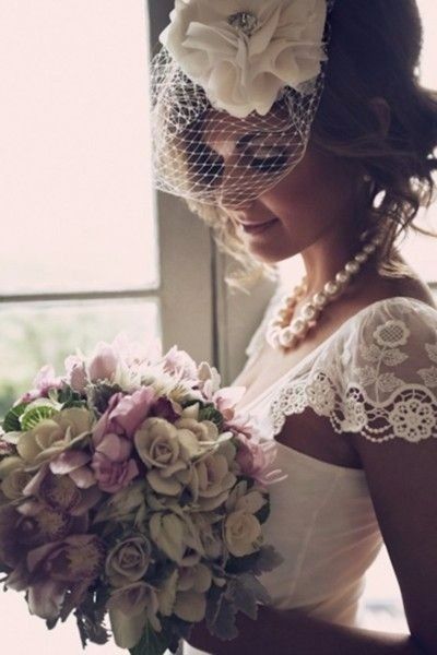 Birdcage veil with flower accessory