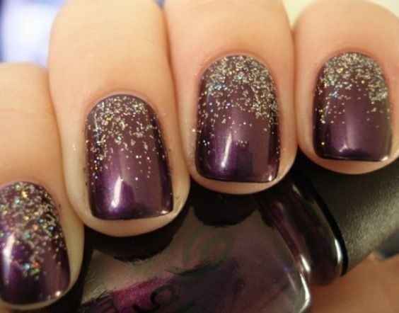 Glitter fad on plum nails