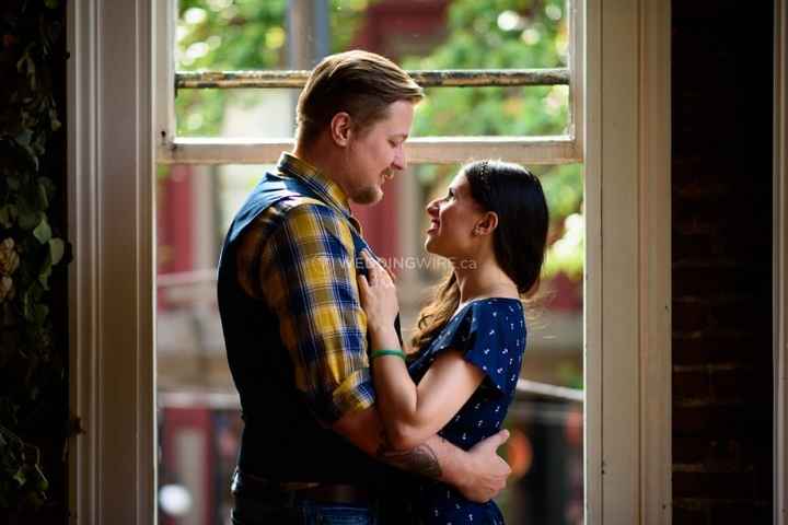 Engagement photo by a window