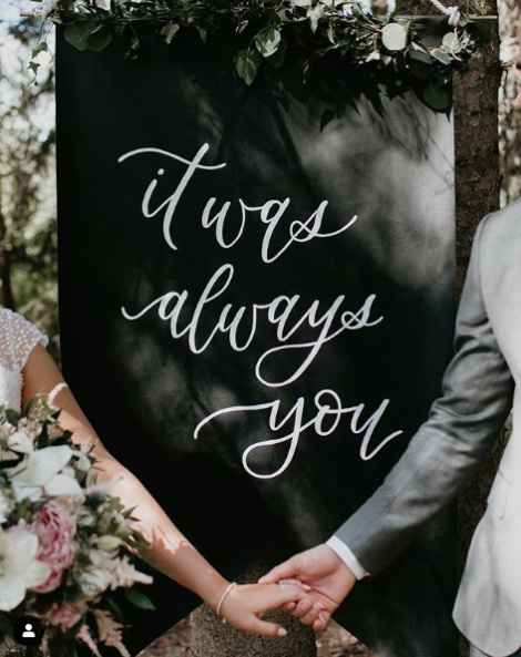 Add a sign to create a backdrop, and add garland