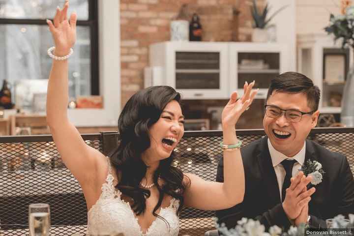 bride and groom laughing at reception