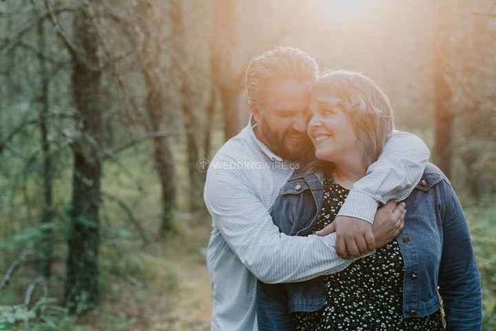 engagement couple outdoors hug lense flare